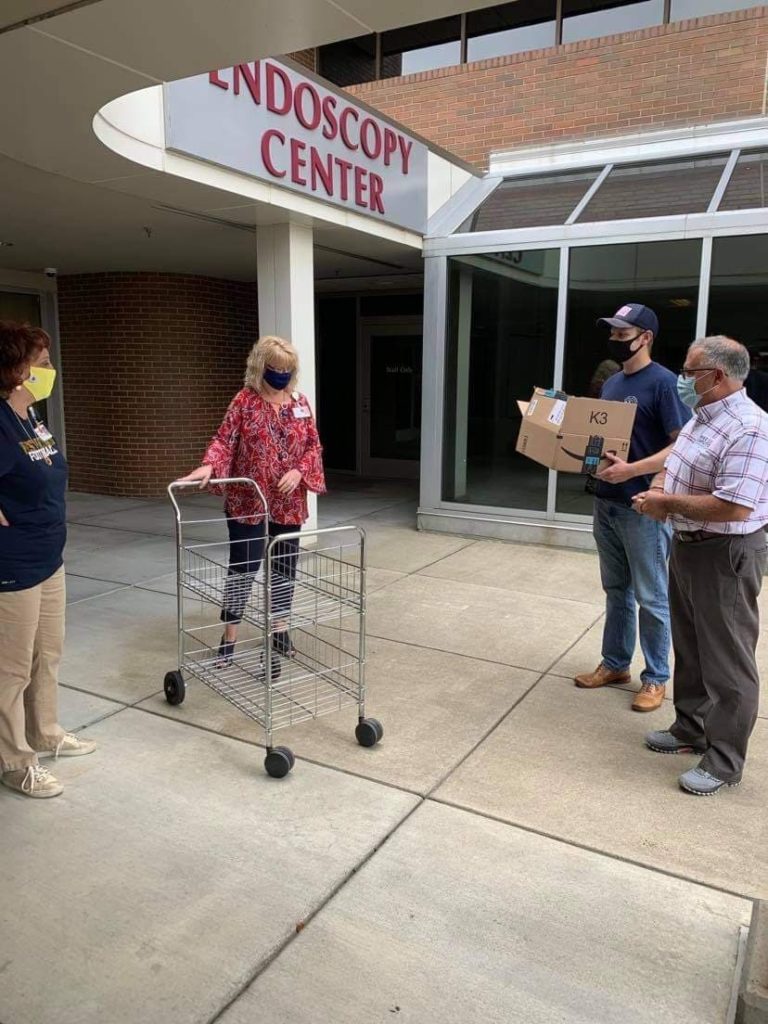 Photo of Delegates delivering cupcakes